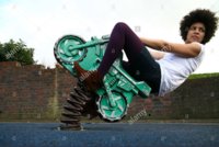 girl-leaning-back-on-playground-motorcycle.jpg