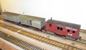 A44a 9-23-16  new old  boxcars  and  a  boxcar  caboose..jpg