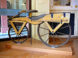 1200px-Draisine_or_Laufmaschine,_around_1820._Archetype_of_the_Bicycle._Pic_01.jpg