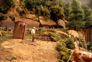 Man at outhouse.jpg