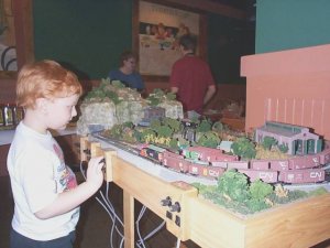 dcp03995 red head boy operating n scale.jpg